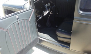 Custom door panel on hot rod black with red stitching
