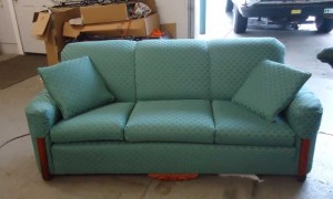 Green couch with throw pillows