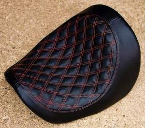 Custom motorcycle seat with red diamond stitching